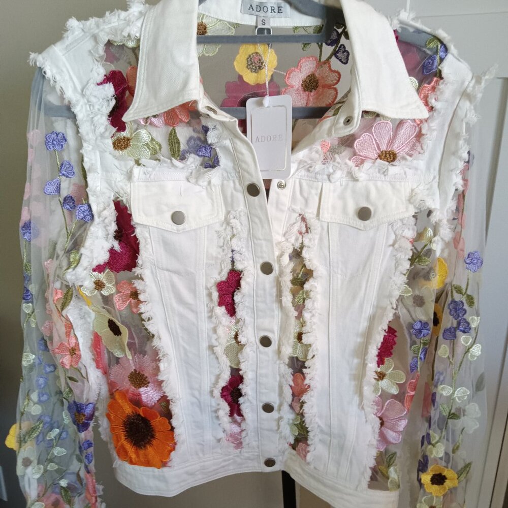 A new Adore white denim jacket with lots of flower power!